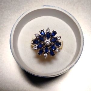 A vintage 24K white gold topaz and diamond ring